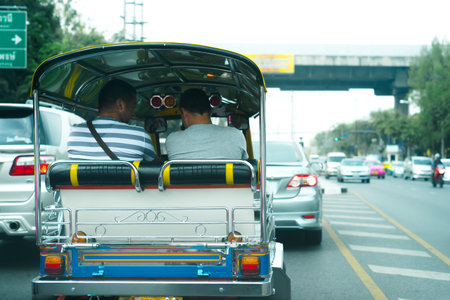 Back side of tuk tuk with passenger. Thailand.