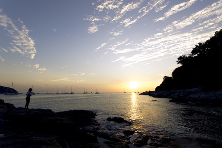 Women on the beach with sun set.の写真素材