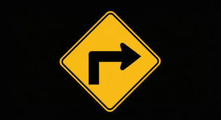 A yellow and black road sign indicating a right turn against a stark black background. This image clearly depicts the warning symbol.の素材