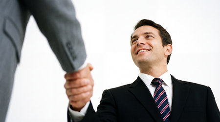 Businessman shaking hands with another business partner. Successful deal concept.の素材