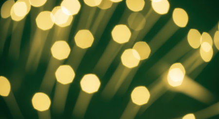 Close-up shot of bokeh lights with a dark green background, creating a dreamy and abstract look.の素材