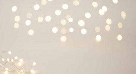 A dreamy bokeh background featuring soft, warm lights creating a magical and ethereal atmosphere, perfect for adding a touch of elegance to any design.の素材