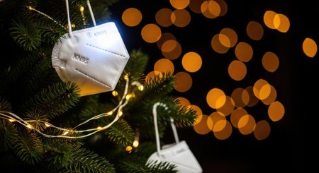 A Christmas tree adorned with face masks, symbolizing the impact of the pandemic on holiday traditions and celebrations.の素材