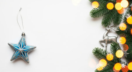 A bright Christmas scene with a blue star ornament and festive lights on a white background.の素材
