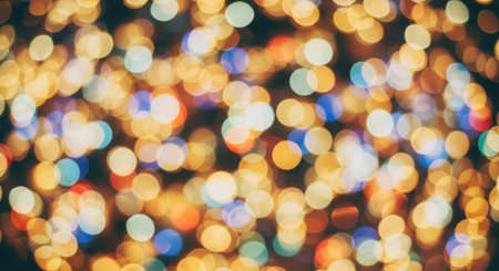 A vibrant bokeh background featuring a mix of warm orange and cool blue lights, creating a festive and dreamy atmosphere.の素材