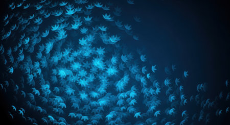 A mesmerizing abstract background featuring a dynamic swirl of glowing blue bokeh lights shaped like small leaves or flowers against a deep dark backdrop creating a magical feel.の素材