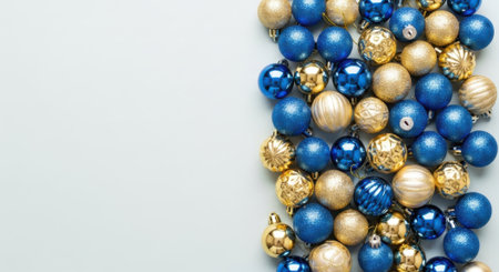 A vibrant arrangement of blue and gold Christmas ornaments, creating a festive and colorful display.の素材