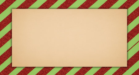A festive holiday card with a blank beige rectangle in the center, surrounded by a red and green striped border, perfect for seasonal greetings.の素材