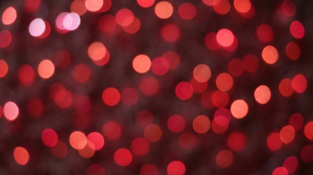 A dark background filled with numerous out-of-focus red lights, creating a bokeh effect perfect for festive or celebratory themes.の素材