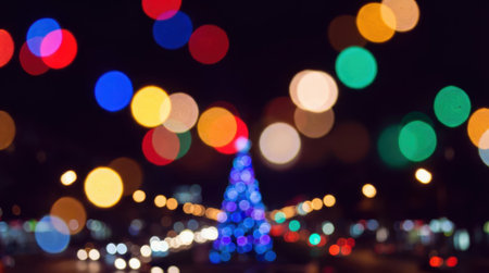A festive night scene with a decorated Christmas tree illuminated by colorful bokeh lights, creating a magical and celebratory atmosphere.の素材