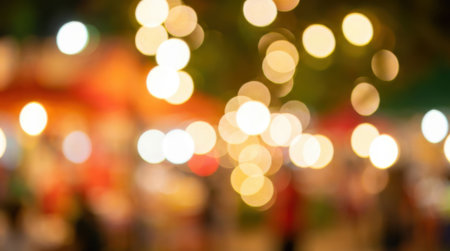 Blurred lights creating a bokeh effect at a night festival, perfect for backgrounds and celebrations.の素材
