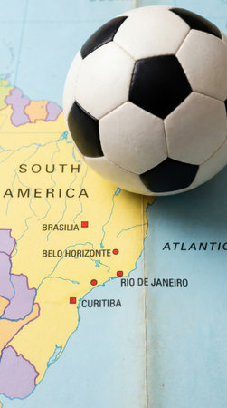 Soccer ball on a map of South America, focus on the ballの素材