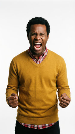 Young african american man shouting, white background, studio shotの素材