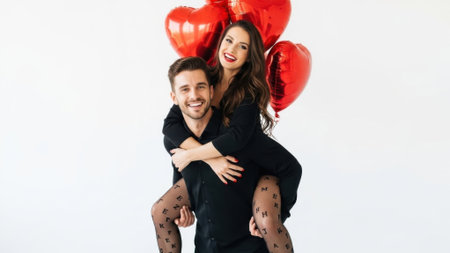 A joyful couple shares a piggyback ride, surrounded by vibrant red heart-shaped balloons, celebrating love and happiness.の素材