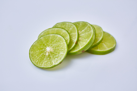 Limes sliced on white backgroundの写真素材