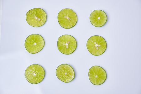 Limes sliced on white backgroundの写真素材