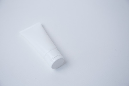 Blank white tube on white backgroundの写真素材