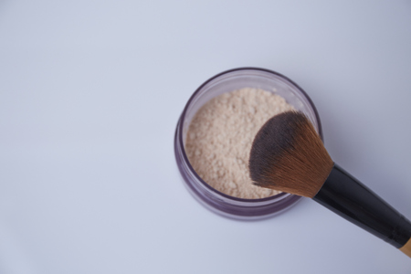 Brush and powder on white backgroundの写真素材