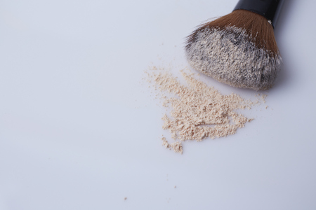 Brush and powder on white backgroundの写真素材