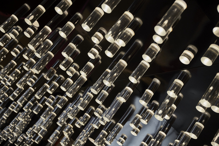 Hanging modern illuminate light on ceilingの写真素材