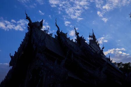 Silhouette of silver Buddha buildingの写真素材