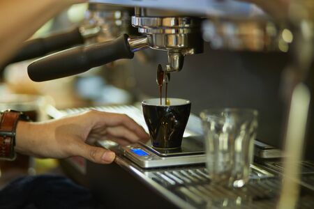 Barista cafe making fresh coffee by machineの写真素材