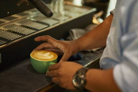Barista cafe making fresh coffee by machineの写真素材