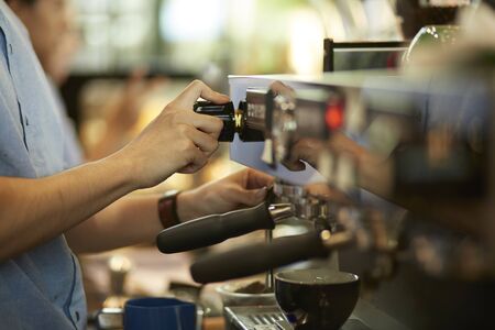 Barista cafe making fresh coffee by machineの写真素材