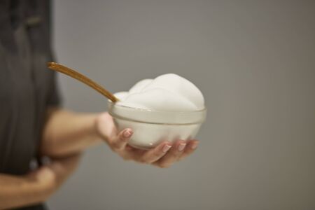White natural cleansing foam in glass cupの写真素材