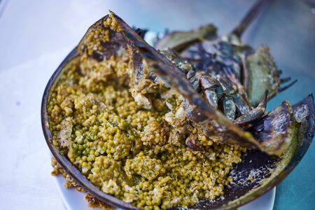 Grilled horseshoe crab eggs prepare for serve with spicy saladの写真素材