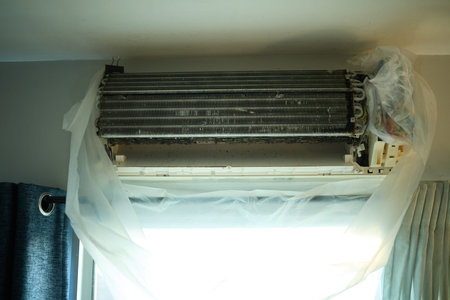 Air conditioner on the wall in the room, prepare for cleaning serviceの写真素材