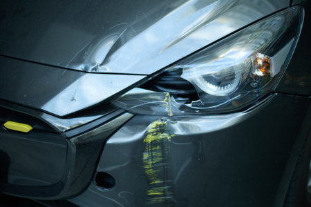 Headlight of a crash car, close-up of broken headlightの写真素材