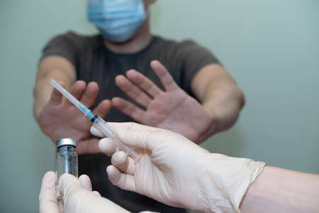 the patient does not agree to put the vaccine, vaccination. anti-vaccinationの写真素材