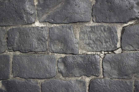 A black cobblestone background texture の写真素材