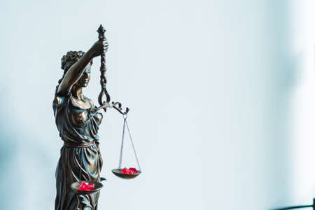statue of justice inside a lawyer officeの写真素材