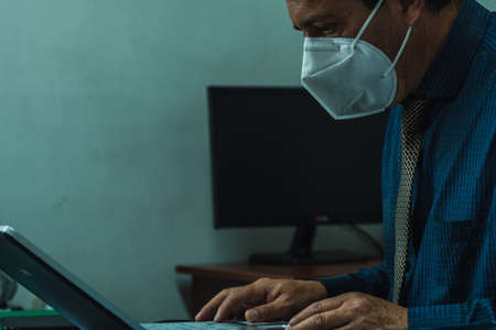 lawyer working in an office with a computer while reading, office worker concept.の写真素材