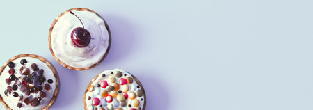 Colourful cupcakes on light backgroundの写真素材