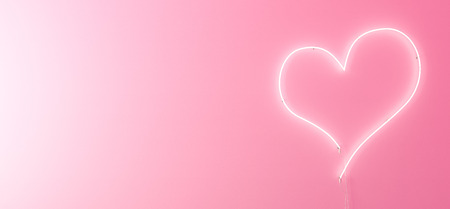 Neon and pink glow effect of love with space for textの写真素材