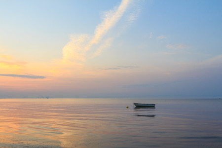 Boat at beach in sunriseの写真素材