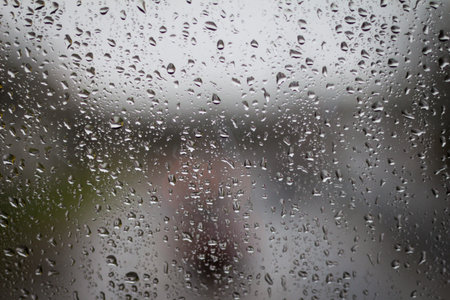 waterdrops on clear surface. can be used for rainy days, backgrounds, sadness and weather themes