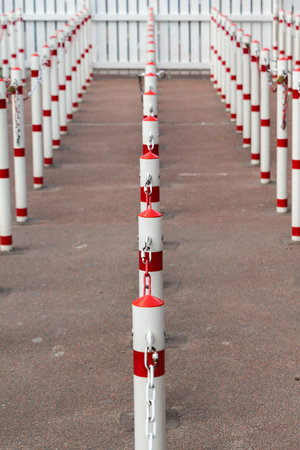 Poles illustrating waiting line. white and red polesの写真素材