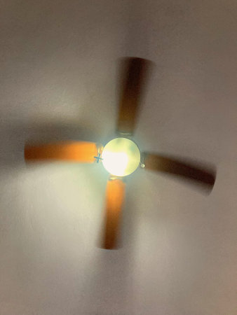 Ceiling fan with light, close-up of photo.の写真素材