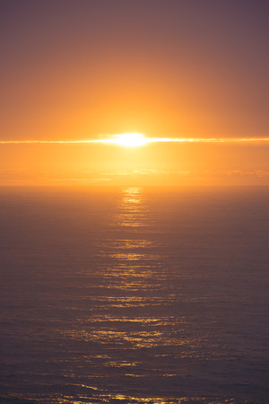 Dramatic sunset over the oceanの写真素材
