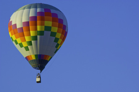 Hot Air balloon against a blue skyの写真素材