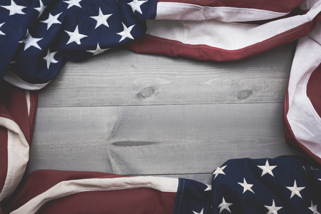 The flag of the United Sates of America on a grey plank background with copy spaceの写真素材