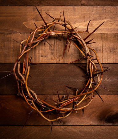 An authentic crown of thorns on a wooden background. Easter Themeの写真素材