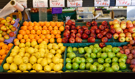 Fresh fruit market with apples and orangesの写真素材
