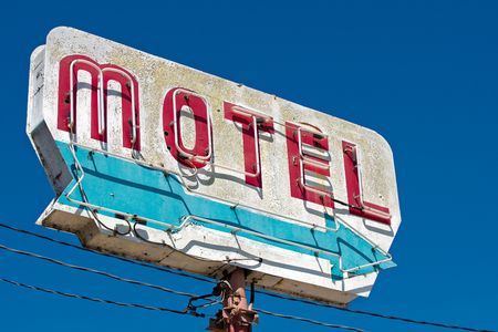 Old, vintage, flaking, motel sign with an arrowの写真素材
