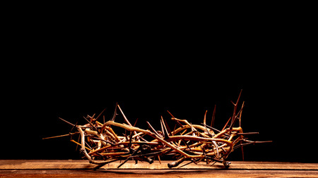 An authentic crown of thorns on a wooden background. Easter Themeの写真素材
