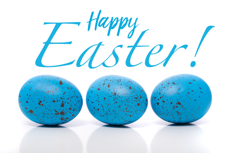 A group of blue Easter Eggs with speckles on a white backgroundの写真素材